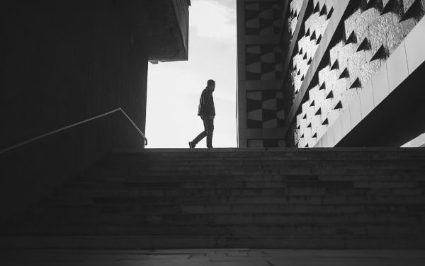 Picture of Silhouette of a walking man in a city