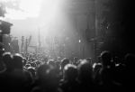 Picture of Black and white silhouette of people crowd walking down the pedestrian street under the sunshine